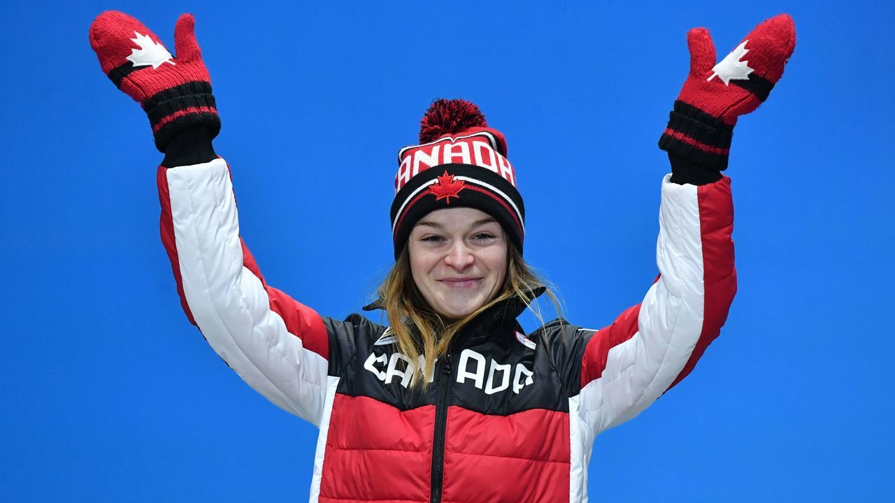 Canada's silver medallist Kim Boutin poses on the podium during the medal ceremony for the short track Women's 1000m at the Pyeongchang Medals Plaza during the Pyeongchang 2018 Winter Olympic Games in Pyeongchang on February 23, 2018. / AFP PHOTO / Dimitar DILKOFF