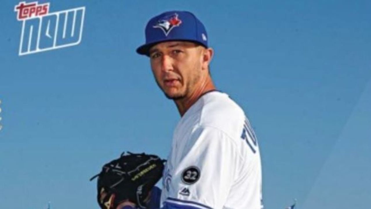 Troy Tulowitzki poses as a pitcher on Blue Jays' photo day