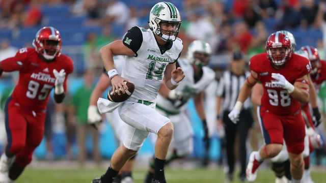 BOCA RATON, FL - NOVEMBER 3: Chase Litton #14 of the Marshall Thundering Herd scrambles out of the pocket during first quarter action against the Florida Atlantic Owls at FAU Stadium on November 3, 2017 in Boca Raton, Florida.