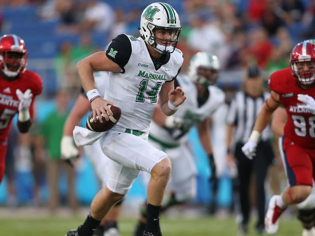 BOCA RATON, FL - NOVEMBER 3: Chase Litton #14 of the Marshall Thundering Herd scrambles out of the pocket during first quarter action against the Florida Atlantic Owls at FAU Stadium on November 3, 2017 in Boca Raton, Florida.