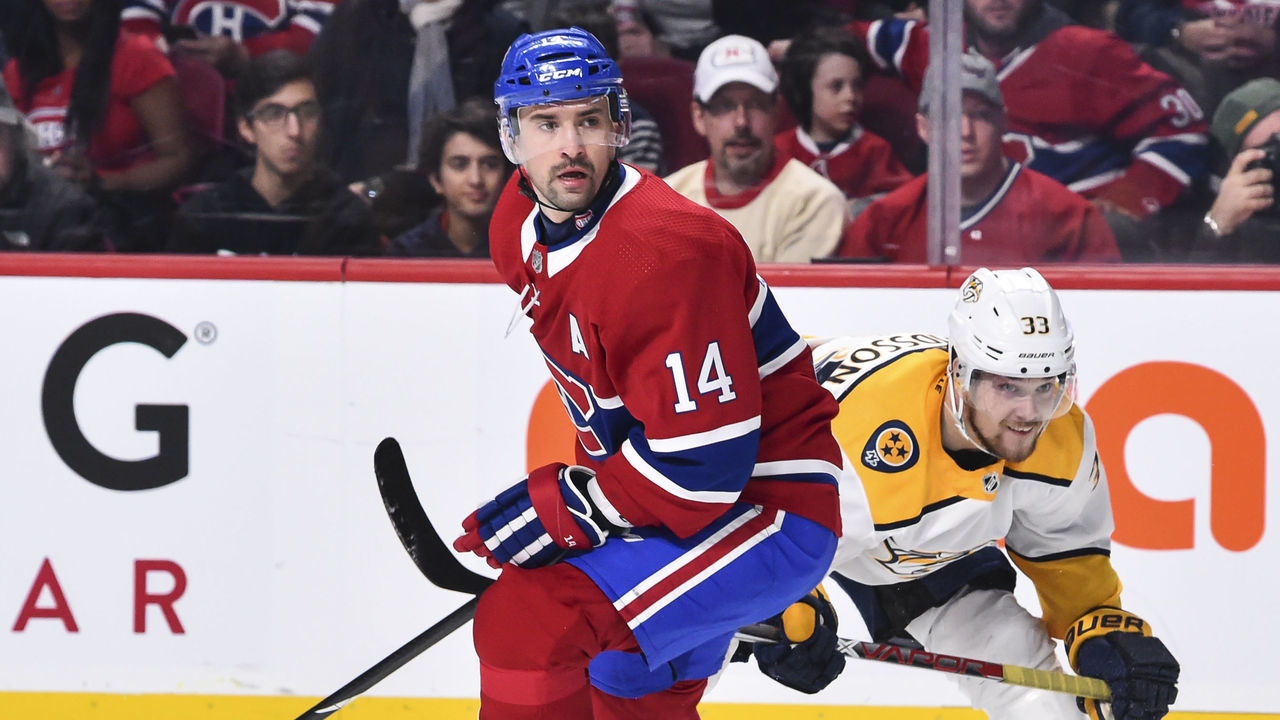 MONTREAL, QC - FEBRUARY 10: Tomas Plekanec #14 of the Montreal Canadiens skates against Viktor Arvidsson #33 of the Nashville Predators during the NHL game at the Bell Centre on February 10, 2018 in Montreal, Quebec, Canada. The Nashville Predators defeated the Montreal Canadiens 3-2 in a shootout.