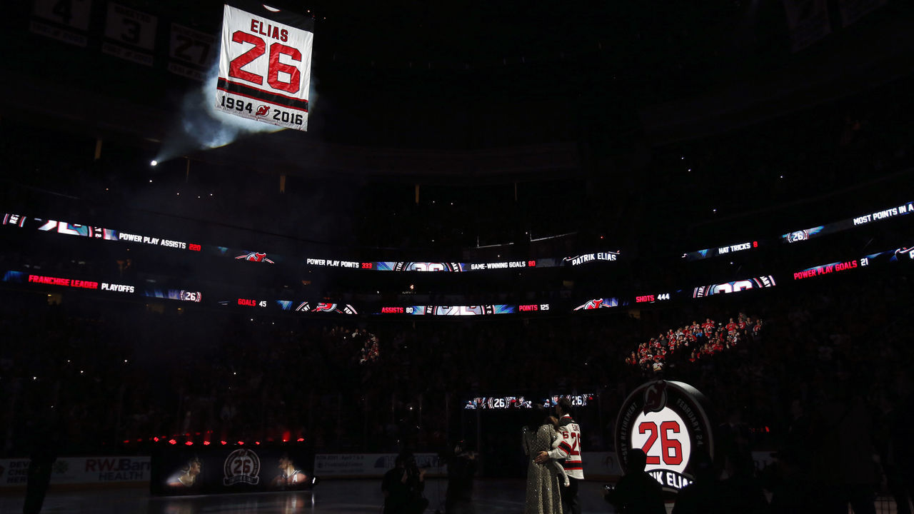 NEWARK, NJ - FEBRUARY 24: Former New Jersey Devil Patrik Elias stands with his family to watch his #26 jersey hoisted to the rafters during a retirement ceremony prior to a game against the New York Islanders at the Prudential Center on February 24, 2018 in Newark, New Jersey.