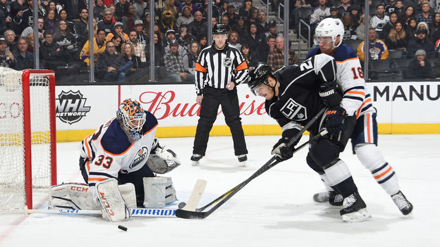 LOS ANGELES, CA - FEBRUARY 24: Dustin Brown #23 of the Los Angeles Kings looks to shoot the puck against Cam Talbot #33 of the Edmonton Oilers at STAPLES Center on February 24, 2018 in Los Angeles, California.