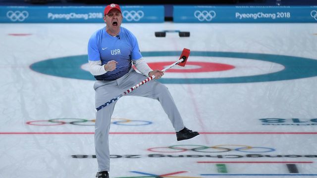 TOPSHOT - USA's John Shuster celebrates a point during the curling men's gold medal game between the USA and Sweden during the Pyeongchang 2018 Winter Olympic Games at the Gangneung Curling Centre in Gangneung on February 24, 2018. / AFP PHOTO / WANG Zhao