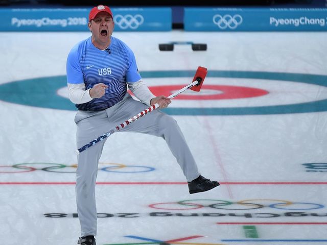 TOPSHOT - USA's John Shuster celebrates a point during the curling men's gold medal game between the USA and Sweden during the Pyeongchang 2018 Winter Olympic Games at the Gangneung Curling Centre in Gangneung on February 24, 2018. / AFP PHOTO / WANG Zhao