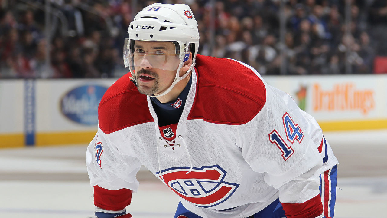 TORONTO, ON - JANUARY 23: Tomas Plekanec #14 of the Montreal Canadiens gets set for a faceoff against the Toronto Maple Leafs during an NHL game at the Air Canada Centre on January 23,2016 in Toronto, Ontario, Canada. The Canadiens defeated the Maple Leafs 3-2 in an overtime shoot-out.