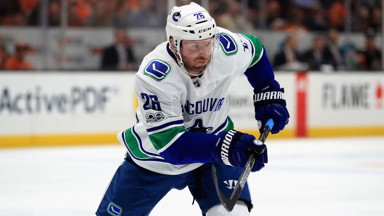 ANAHEIM, CA - NOVEMBER 09: Thomas Vanek #26 of the Vancouver Canucks skates to a loose puck during the second period of a game against the Anaheim Ducks at Honda Center on November 9, 2017 in Anaheim, California.