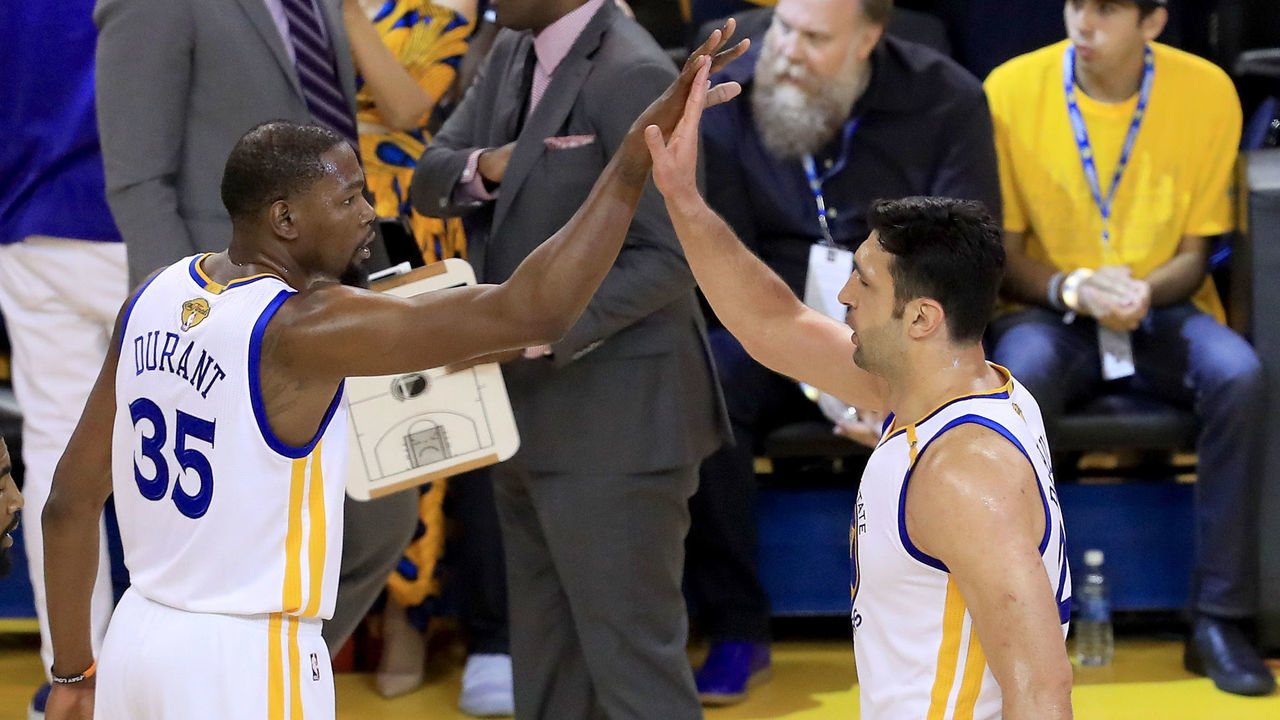 OAKLAND, CA - JUNE 01: Kevin Durant #35 and Zaza Pachulia #27 of the Golden State Warriors react to a play in Game 1 of the 2017 NBA Finals against the Cleveland Cavaliers at ORACLE Arena on June 1, 2017 in Oakland, California.