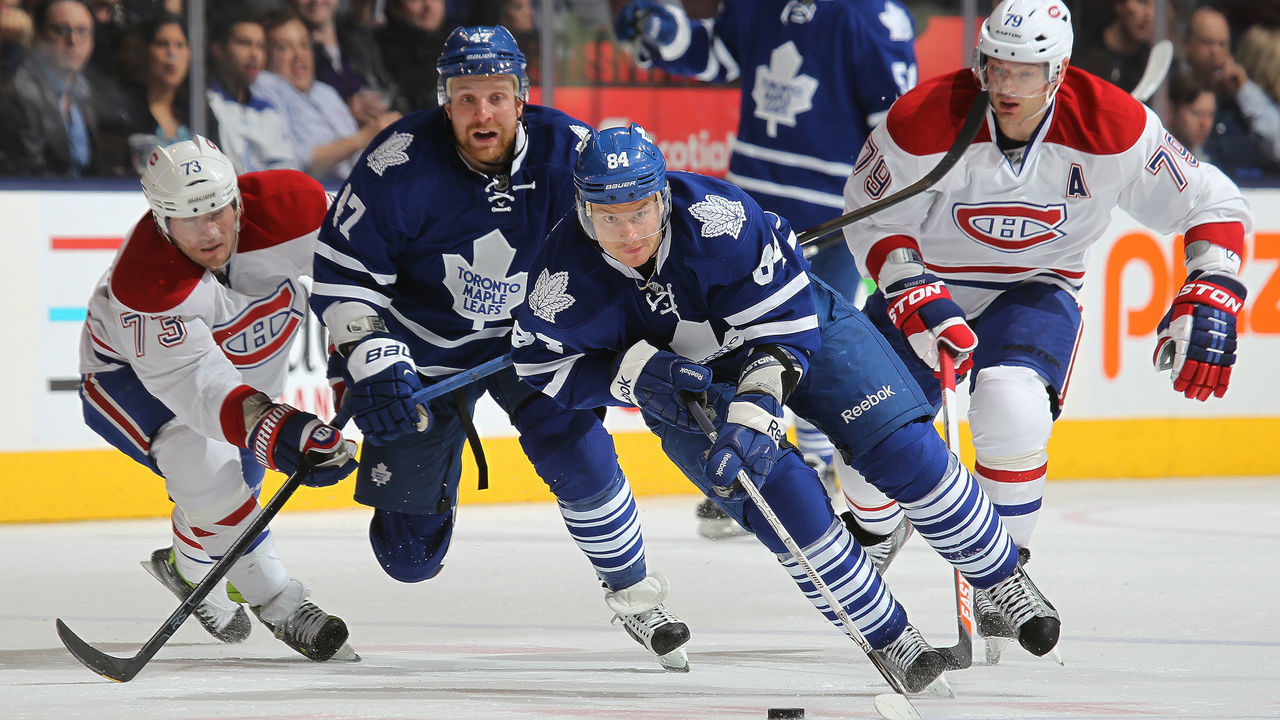 TORONTO, CANADA - APRIL 13: Mikhail Grabovski #84 of the Toronto Maple Leafs heads up ice with the puck in a game against the Montreal Canadiens on April 13, 2013 at the Air Canada Centre in Toronto, Ontario, Canada. The Leafs defeated the Canadiens 5-1.
