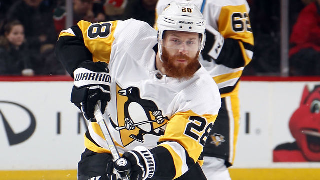 NEWARK, NJ - FEBRUARY 3: Ian Cole #28 of the Pittsburgh Penguins shoots during an NHL hockey game against the New Jersey Devils at Prudential Center on February 3, 2018 in Newark, New Jersey.