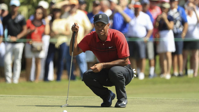 PALM BEACH GARDENS, FL - FEBRUARY 25: Tiger Woods lines up his putt on the second green during the final round of the Honda Classic at PGA National Resort and Spa on February 25, 2018 in Palm Beach Gardens, Florida.