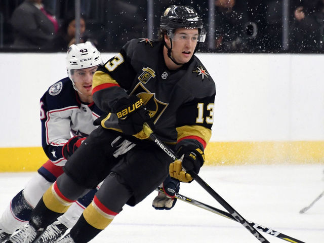 LAS VEGAS, NV - JANUARY 23: Brendan Leipsic #13 of the Vegas Golden Knights skates with the puck against Lukas Sedlak #45 of the Columbus Blue Jackets in the first period of their game at T-Mobile Arena on January 23, 2018 in Las Vegas, Nevada. The Golden Knights won 6-3.