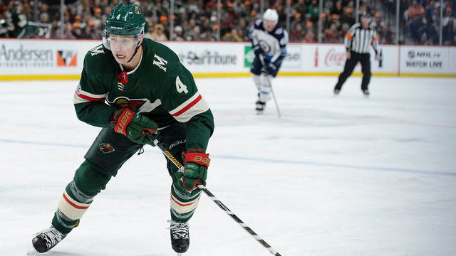 ST PAUL, MN - OCTOBER 31: Mike Reilly #4 of the Minnesota Wild controls the puck against the Winnipeg Jets during the game on October 31, 2017 at Xcel Energy Center in St Paul, Minnesota. The Jets defeated the Wild 2-1.