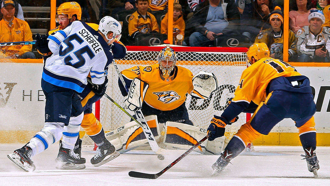 NASHVILLE, TN - DECEMBER 19: Mark Scheifele #55 of the Winnipeg Jets takes a shot on goalie Pekka Rinne #35 of the Nashville Predators during the first period at Bridgestone Arena on December 19, 2017 in Nashville, Tennessee.