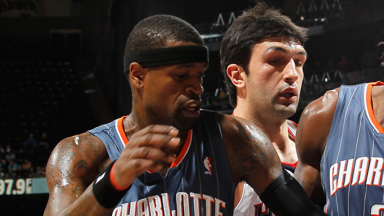 ATLANTA, GA - FEBRUARY 12: Zaza Pachulia #27 of the Atlanta Hawks battles for a rebound against Gerald Wallace #3 and Stephen Jackson #1 of the Charlotte Bobcats at Philips Arena on February 12, 2011 in Atlanta, Georgia. NOTE TO USER: User expressly acknowledges and agrees that, by downloading and/or using this Photograph, user is consenting to the terms and conditions of the Getty Images License Agreement.