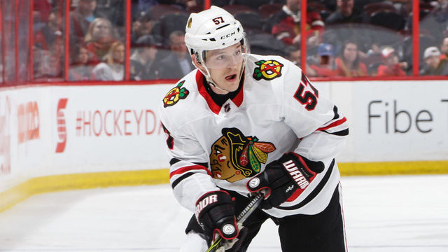 OTTAWA, ON - JANUARY 9: Tommy Wingels #57 of the Chicago Blackhawks skates with the puck against the Ottawa Senators at Canadian Tire Centre on January 9, 2018 in Ottawa, Ontario, Canada.