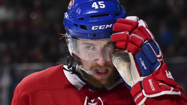 MONTREAL, QC - JANUARY 07: Joe Morrow #45 of the Montreal Canadiens adjusts his visor against the Vancouver Canucks during the NHL game at the Bell Centre on January 7, 2018 in Montreal, Quebec, Canada. The Montreal Canadiens defeated the Vancouver Canucks 5-2.