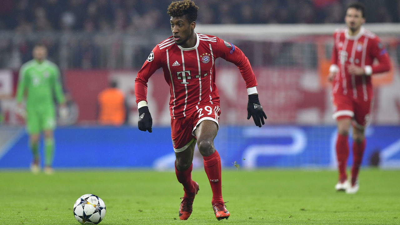Bayern Munich's French forward Kingsley Coman runs with the ball during the UEFA Champions League round of sixteen first leg football match Bayern Munich vs Besiktas Istanbul on February 20, 2018 in Munich, southern Germany. Bayern Munich won 5-0. / AFP PHOTO / John MACDOUGALL