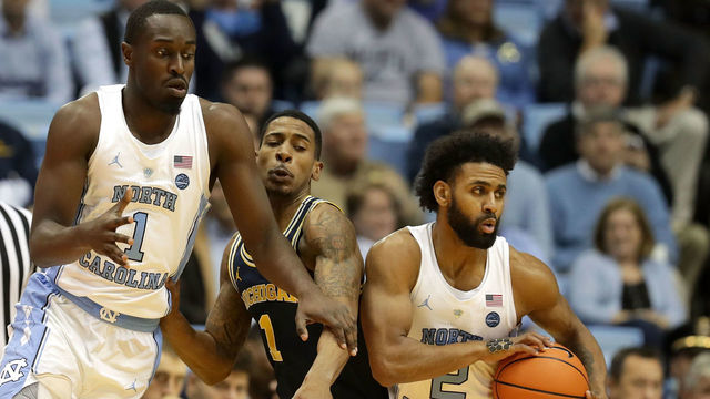 CHAPEL HILL, NC - NOVEMBER 29: Charles Matthews #1 of the Michigan Wolverines tries to stop teammates Theo Pinson #1 and Joel Berry II #2 of the North Carolina Tar Heels during their game at Dean Smith Center on November 29, 2017 in Chapel Hill, North Carolina.