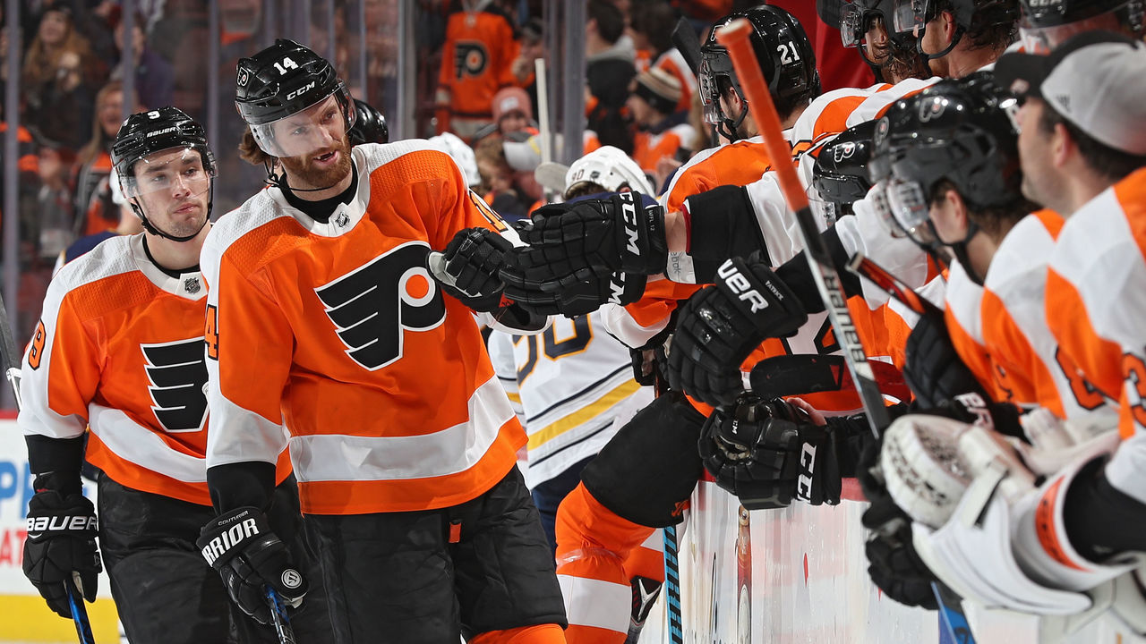 PHILADELPHIA, PA - JANUARY 07: Sean Couturier #14 of the Philadelphia Flyers celebrates a goal by teammate Ivan Provorov #9 against the Buffalo Sabres during the third period at Wells Fargo Center on January 7, 2018 in Philadelphia, Pennsylvania.