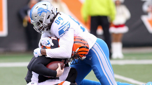 CINCINNATI, OH - DECEMBER 24: Ezekiel Ansah #94 of the Detroit Lions sacks Andy Dalton #14 of the Cincinnati Bengals during the first half at Paul Brown Stadium on December 24, 2017 in Cincinnati, Ohio.