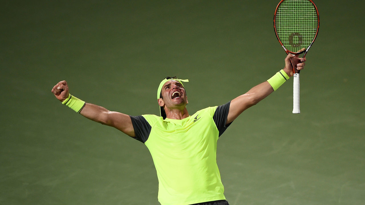 DUBAI, UNITED ARAB EMIRATES - FEBRUARY 27: Malek Jaziri of Tunisia celebrates his win against Grigor Dimitrov of Bulgaria on day two of the ATP Dubai Duty Free Tennis Championships at the Dubai Duty Free Stadium on February 27, 2018 in Dubai, United Arab Emirates.