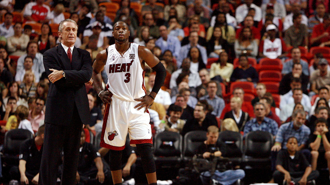 MIAMI - NOVEMBER 21: Head coach Pat Riley and Dwyane Wade #3 of the Miami Heat talk during free throws while taking on the Atlanta Hawks at American Airlines Arena on November 21, 2007 in Miami, Florida.