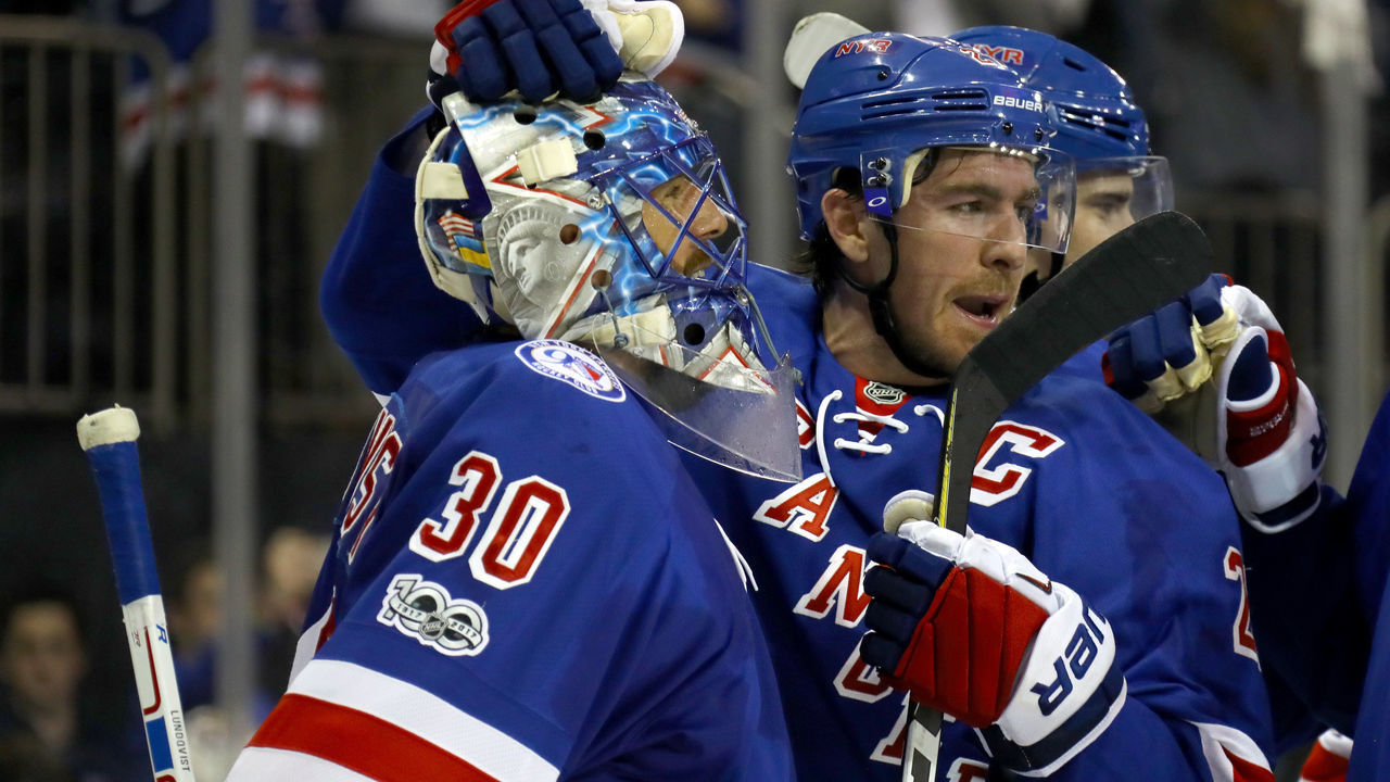 NEW YORK, NY - APRIL 22: Henrik Lundqvist #30 of the New York Rangers celebrates with teammate Ryan McDonagh #27 after defeating the Montreal Canadiens in Game Six of the Eastern Conference to win the First Round with a score of 3 to 1 during the 2017 NHL Stanley Cup Playoffs at Madison Square Garden on April 22, 2017 in New York City.