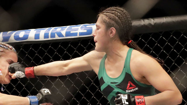 HOUSTON, TX - FEBRUARY 04: Alexa Grasso (green) punches Felice Herrig (blue) in the Women's Strawweight Bout during UFC Fight Night at the Toyota Center on February 4, 2017 in Houston, Texas.