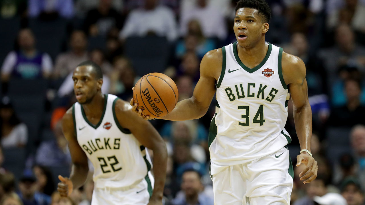CHARLOTTE, NC - NOVEMBER 01: Teammates Khris Middleton #22 and Giannis Antetokounmpo #34 of the Milwaukee Bucks go up the floor against the Charlotte Hornets during their game at Spectrum Center on November 1, 2017 in Charlotte, North Carolina.