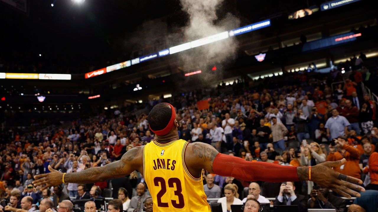 PHOENIX, AZ - JANUARY 13: LeBron James #23 of the Cleveland Cavaliers throws powder into the air before the start of the NBA game against the Phoenix Suns at US Airways Center on January 13, 2015 in Phoenix, Arizona. The Suns defeated the Cavaliers 107-100.