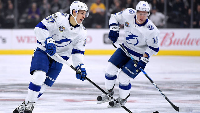 LOS ANGELES, CA - NOVEMBER 09: Yanni Gourde #37 of the Tampa Bay Lightning carries the puck over the blueline as he is trailed by Ondrej Palat #18 during the game against the Los Angeles Kings at Staples Center on November 9, 2017 in Los Angeles, California.