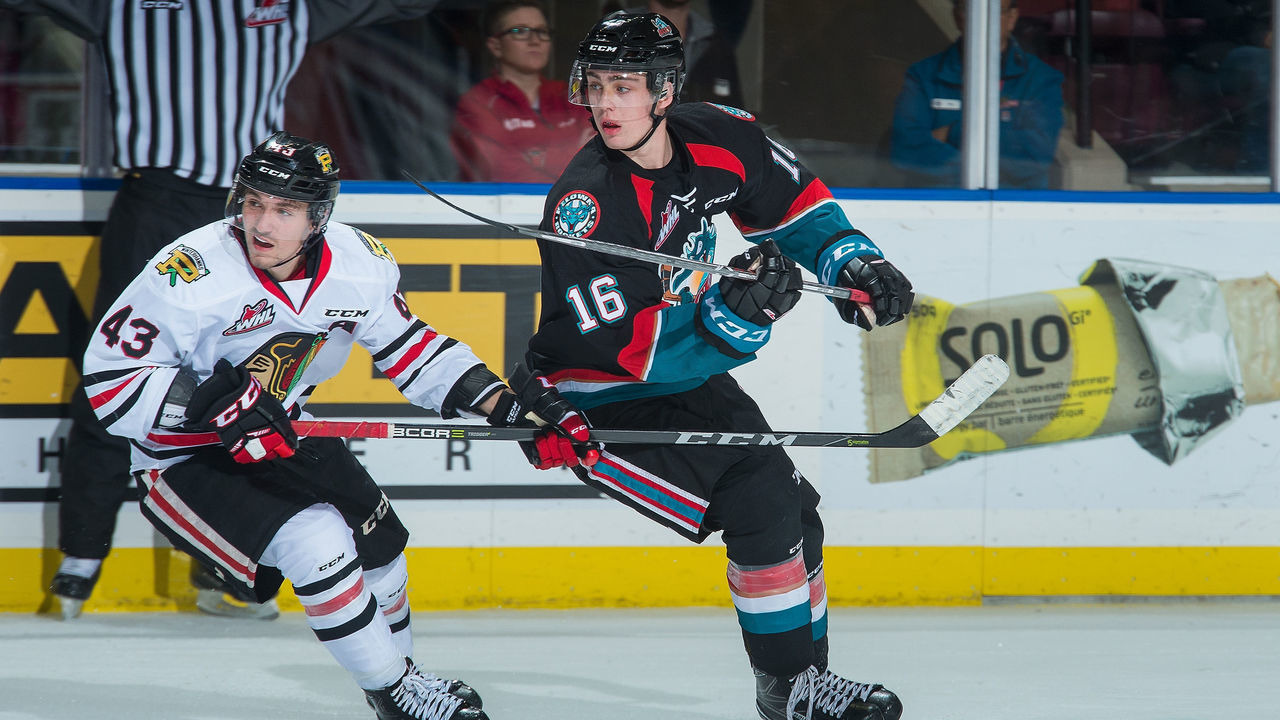 KELOWNA, BC - OCTOBER 20: Skyler McKenzie #43 of the Portland Winterhawks stick checks Kole Lind #16 of the Kelowna Rockets during third period at Prospera Place on October 20, 2017 in Kelowna, Canada.