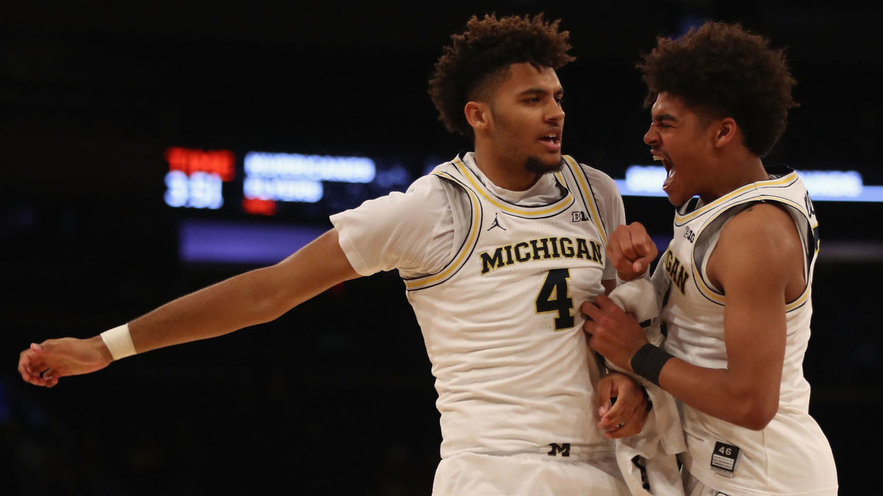 NEW YORK, NY - MARCH 01: Isaiah Livers #4 and Jordan Poole #2 of the Michigan Wolverines celebrate in the second half against the Iowa Hawkeyes during the second round of the Big Ten Basketball Tournament at Madison Square Garden on March 1, 2018 in New York City.