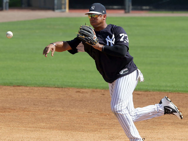 TAMPA, FL - MAR 01: Russell Wilson (73) makes the throw over to first base to complete the double play during the New York Yankees spring training workout on March 01, 2018, at George M. Steinbrenner Field in Tampa, FL. Wilson, who is the Seattle Seahawks starting quarterback is in Yankees camp working out with the major league team.