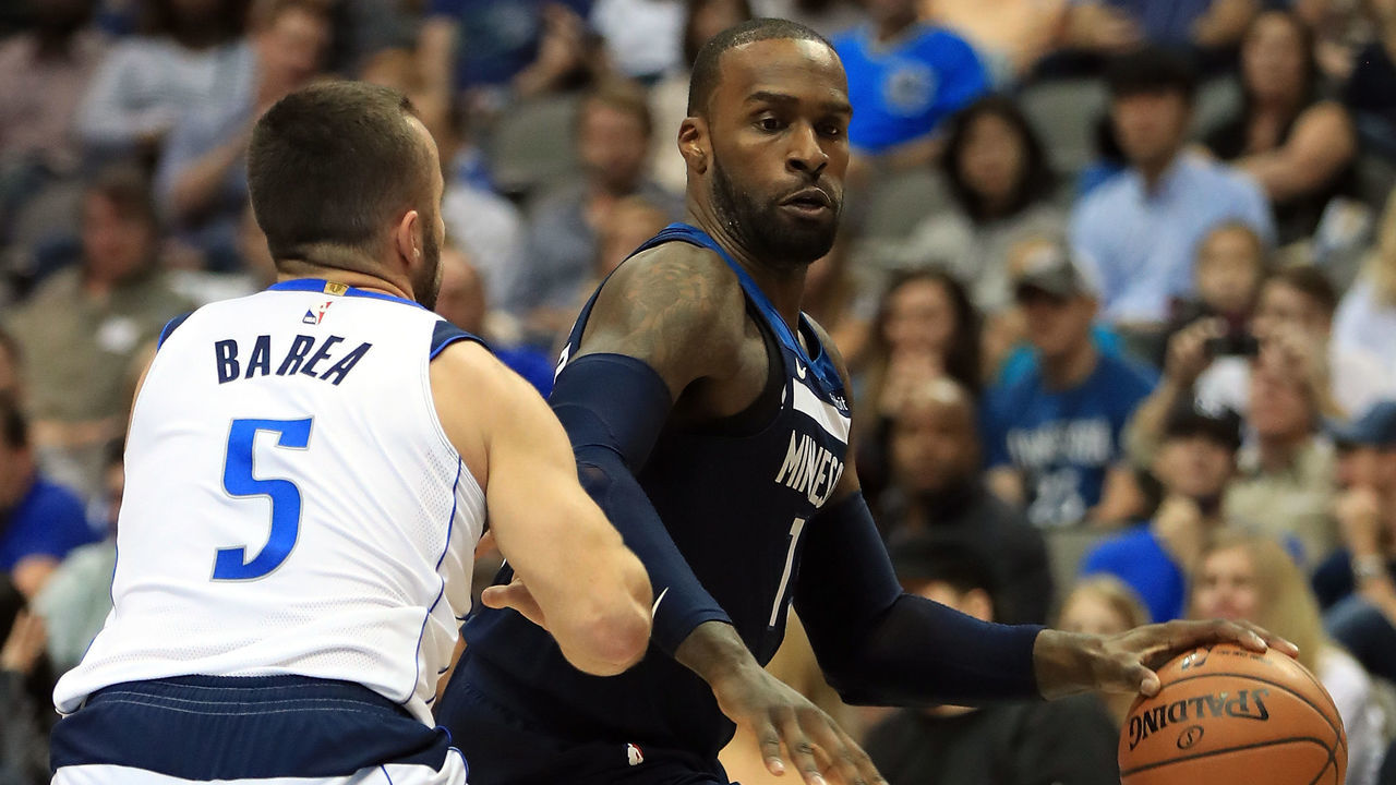 DALLAS, TX - NOVEMBER 17: Shabazz Muhammad #15 of the Minnesota Timberwolves dribbles the ball against J.J. Barea #5 of the Dallas Mavericks at American Airlines Center on November 17, 2017 in Dallas, Texas.