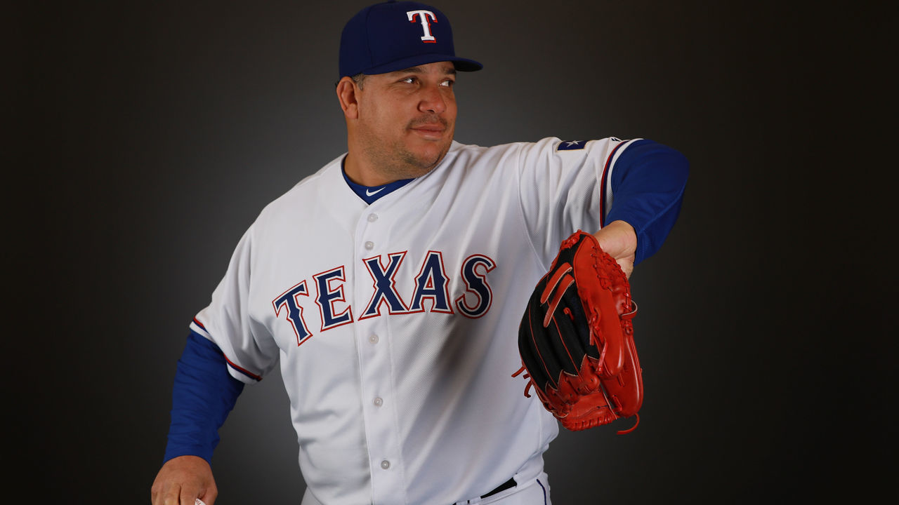 SURPRISE, AZ - FEBRUARY 21: Bartolo Colon #40 of the Texas Rangers poses during Texas Rangers Photo Day at the Surprise Stadium training facility on February 21, 2018 in Surprise, Arizona.