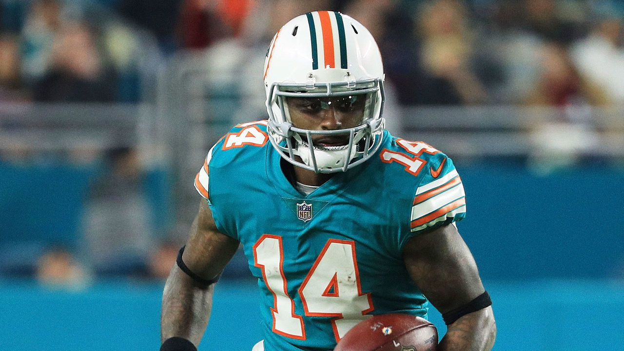 MIAMI GARDENS, FL - DECEMBER 11: Jarvis Landry #14 of the Miami Dolphins carries the ball in the third quarter against the New England Patriots at Hard Rock Stadium on December 11, 2017 in Miami Gardens, Florida.