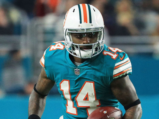 MIAMI GARDENS, FL - DECEMBER 11: Jarvis Landry #14 of the Miami Dolphins carries the ball in the third quarter against the New England Patriots at Hard Rock Stadium on December 11, 2017 in Miami Gardens, Florida.