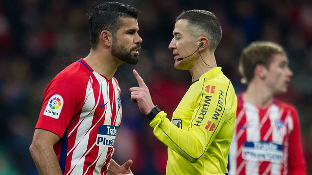 MADRID, SPAIN - FEBRUARY 04: Diego Costa of Atletico Madrid has words with referee Ignacio Iglesias Villanueva during the La Liga match between Atletico Madrid and Valencia at Wanda Metropolitano stadium on February 4, 2018 in Madrid, Spain.