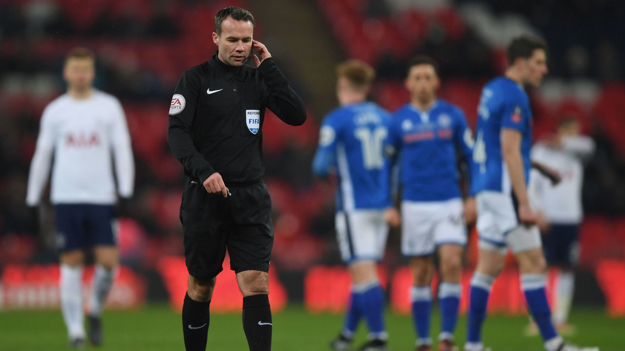 LONDON, ENGLAND - FEBRUARY 28: Referee Paul Tierney consults VAR and dissalows a goal during the Emirates FA Cup Fifth Round Replay match between Tottenham Hotspur and Rochdale on February 28, 2018 in London, United Kingdom.