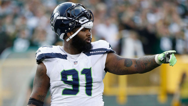 GREEN BAY, WI - SEPTEMBER 10: Sheldon Richardson #91 of the Seattle Seahawks gestures during the fourth quarter against the Green Bay Packers at Lambeau Field on September 10, 2017 in Green Bay, Wisconsin.