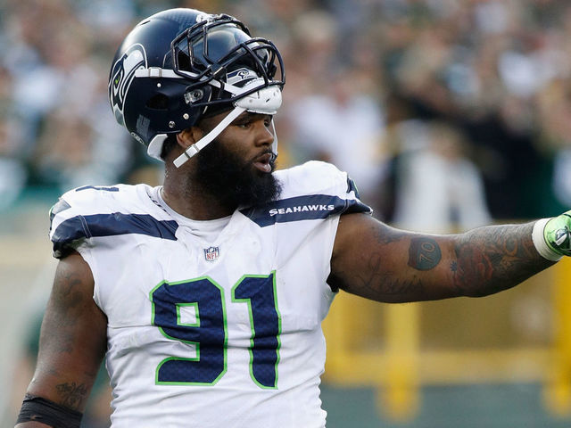 GREEN BAY, WI - SEPTEMBER 10: Sheldon Richardson #91 of the Seattle Seahawks gestures during the fourth quarter against the Green Bay Packers at Lambeau Field on September 10, 2017 in Green Bay, Wisconsin.