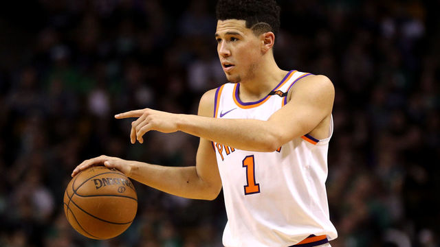 BOSTON, MA - DECEMBER 2: Devin Booker #1 of the Phoenix Suns carries the ball against the Boston Celtics during the second half at TD Garden on December 2, 2017 in Boston, Massachusetts. The Celtics defeat the Suns 116-111.