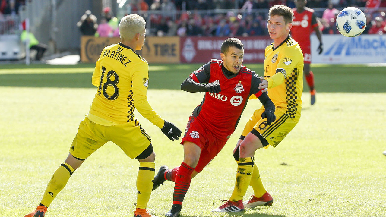 TORONTO, ON - MARCH 3 - Sebastian Giovinco of TFC tries to squeeze past Cristian Martinez (left) and Wil Trapp (right) of Columbus during the 1st half of MLS action as the Toronto FC host the Columbus Crew in their home opener at BMO Field on March 3, 2018. (Carlos Osorio/Toronto Star via Getty Images)