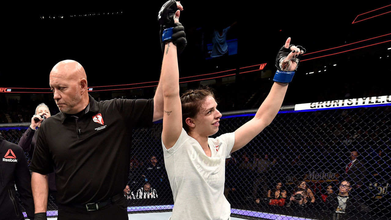 LAS VEGAS, NV - MARCH 03: Mackenzie Dern celebrates after her split-decision victory over Ashley Yoder in their women's strawweight bout during the UFC 222 event inside T-Mobile Arena on March 3, 2018 in Las Vegas, Nevada.