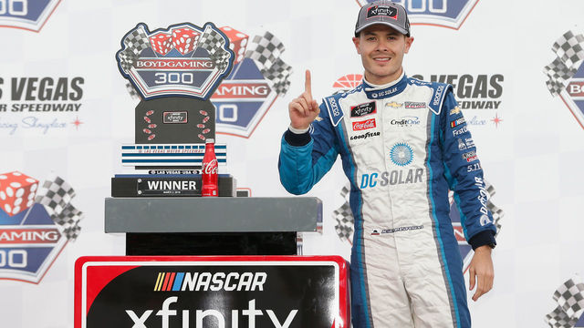 LAS VEGAS, NV - MARCH 03: Kyle Larson, driver of the #42 DC Solar Chevrolet, poses with the trophy after winning the NASCAR Xfinity Series Boyd Gaming 300 at Las Vegas Motor Speedway on March 3, 2018 in Las Vegas, Nevada.