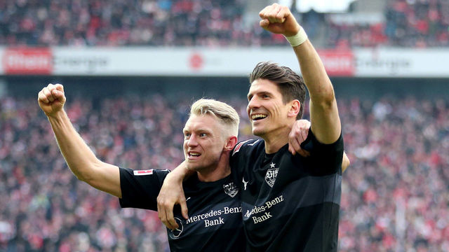 COLOGNE, GERMANY - MARCH 04: Andreas Beck of Stuttgart celebrates the third goal with Mario Gomez of Stuttgart (R) during the Bundesliga match between 1. FC Koeln and VfB Stuttgart at RheinEnergieStadion on March 4, 2018 in Cologne, Germany.