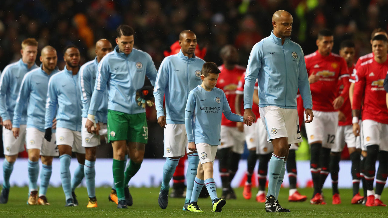 MANCHESTER, ENGLAND - DECEMBER 10: Vincent Kompany of Manchester City leads out his team during the Premier League match between Manchester United and Manchester City at Old Trafford on December 10, 2017 in Manchester, England.