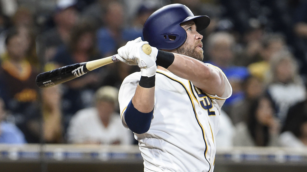 SAN DIEGO, CALIFORNIA - SEPTEMBER 8: Ryan Schimpf #11 of the San Diego Padres hits a three-run home run during the third inning of a baseball game against the Colorado Rockies at PETCO Park on September 8, 2016 in San Diego, California.